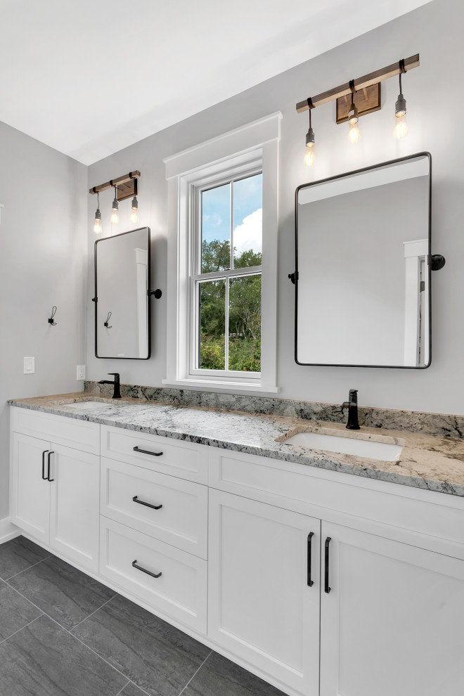 Inspiration for a large country master slate floor, gray floor and single-sink bathroom remodel in Other with shaker cabinets, white cabinets, a two-piece toilet, gray walls, an undermount sink, granite countertops, beige countertops and a built-in vanity