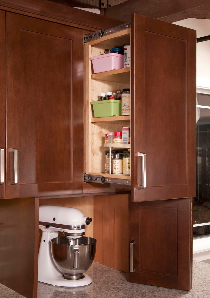 Inspiration for a mid-sized transitional dark wood floor kitchen remodel in Seattle with an undermount sink, shaker cabinets, dark wood cabinets, beige backsplash, subway tile backsplash, stainless steel appliances and a peninsula