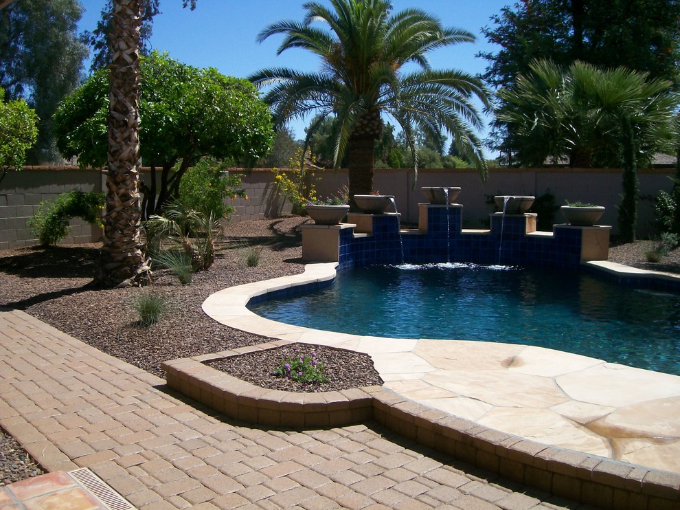 Inspiration for a transitional backyard custom-shaped pool fountain remodel in Phoenix