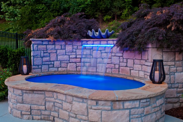 Custom Spa With Waterfall And Planter Wall Above The Spa
