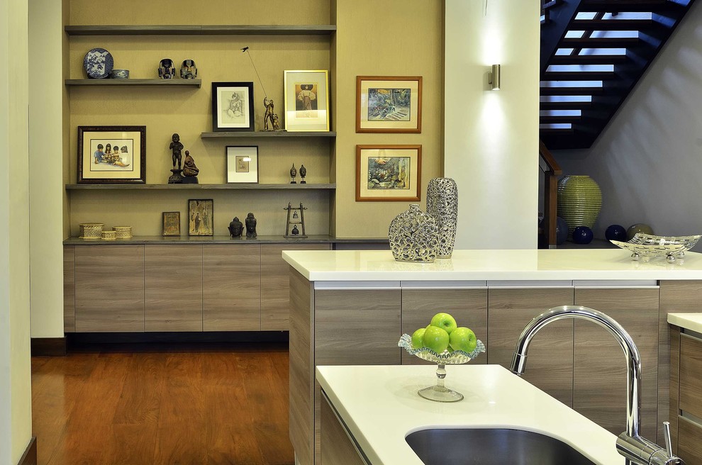 This is an example of a modern kitchen in Other with an undermount sink, flat-panel cabinets and medium wood cabinets.