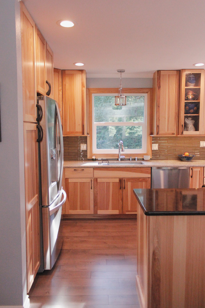 Kitchen - large transitional l-shaped light wood floor kitchen idea with an undermount sink, shaker cabinets, light wood cabinets, quartzite countertops, brown backsplash, stainless steel appliances and an island