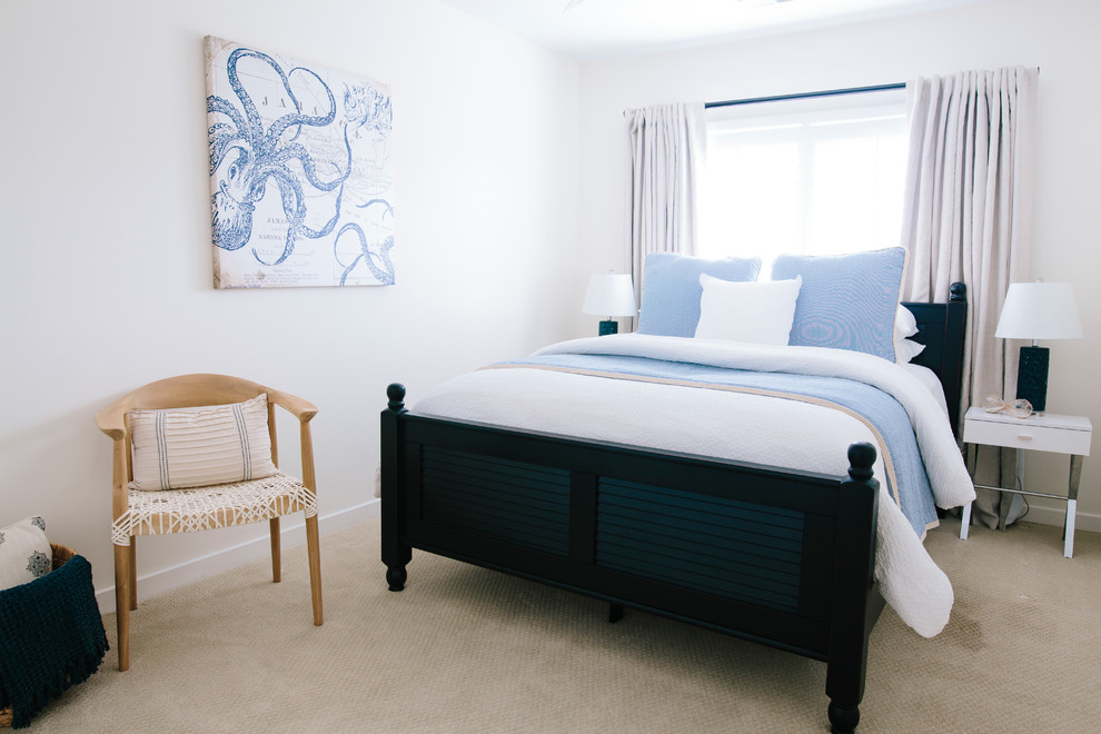 This is an example of a mid-sized transitional guest bedroom in Other with white walls, carpet and beige floor.