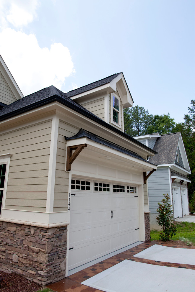 This is an example of a mid-sized transitional two-storey exterior in Raleigh with vinyl siding.