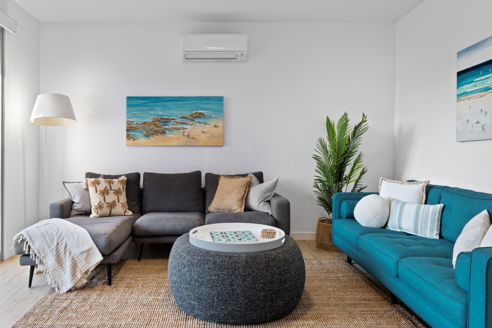 This is an example of a beach style family room in Adelaide.