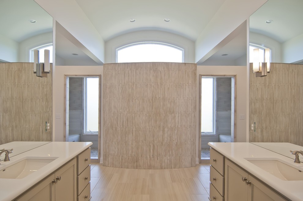 Example of a transitional master gray tile bathroom design with gray cabinets, an undermount sink and quartz countertops