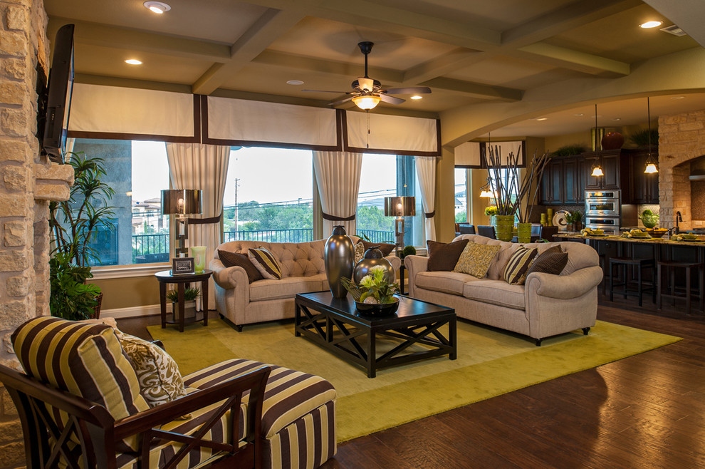 Inspiration for a traditional open concept living room in Austin with dark hardwood floors.