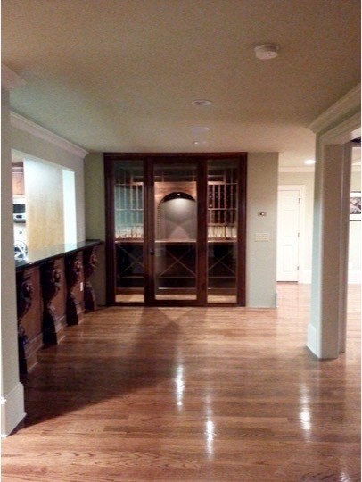 Photo of a small traditional wine cellar in Atlanta with storage racks.