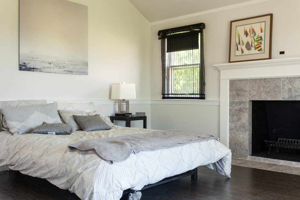 This is an example of a contemporary bedroom in Boston with white walls.