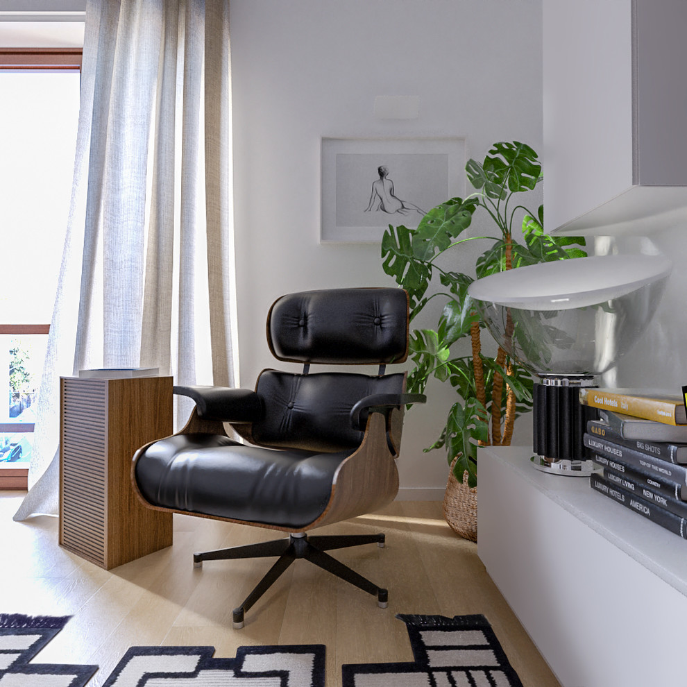 Esempio di un soggiorno design di medie dimensioni e aperto con pareti bianche, parquet chiaro e TV a parete