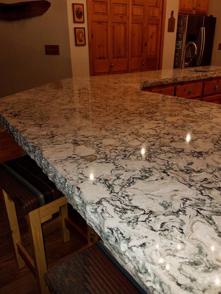 Eat-in kitchen - large rustic u-shaped eat-in kitchen idea in Sacramento with an undermount sink, raised-panel cabinets, medium tone wood cabinets, quartz countertops, multicolored backsplash, stainless steel appliances and a peninsula