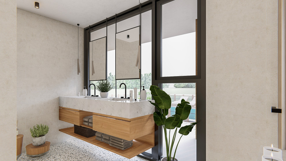 Пример оригинального дизайна: главная ванная комната среднего размера в стиле кантри с открытыми фасадами, белыми фасадами, отдельно стоящей ванной, угловым душем, инсталляцией, бежевой плиткой, керамической плиткой, бежевыми стенами, бетонным полом, монолитной раковиной, мраморной столешницей, разноцветным полом, открытым душем, серой столешницей, нишей, тумбой под две раковины, подвесной тумбой и панелями на стенах