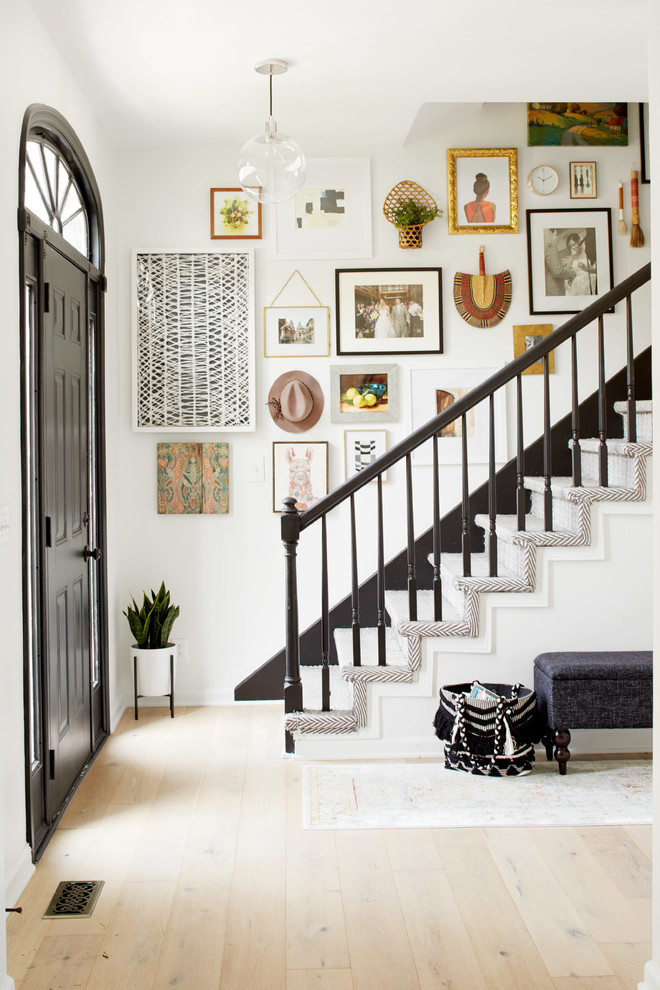 This is an example of an eclectic wood straight staircase in Nashville with wood risers.