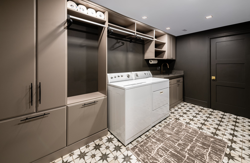 Design ideas for a large transitional single-wall dedicated laundry room in DC Metro with an undermount sink, flat-panel cabinets, beige cabinets, quartz benchtops, black walls, porcelain floors, a side-by-side washer and dryer, multi-coloured floor and grey benchtop.