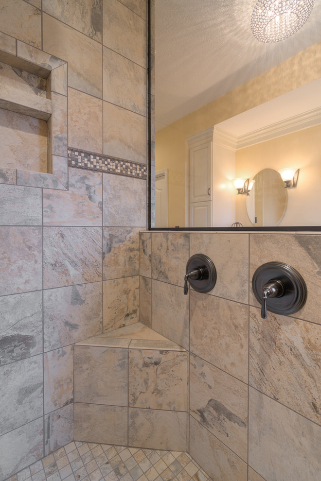 Example of a mid-sized transitional master multicolored tile ceramic tile home design design with raised-panel cabinets, beige cabinets, a two-piece toilet, beige walls, an undermount sink and quartz countertops