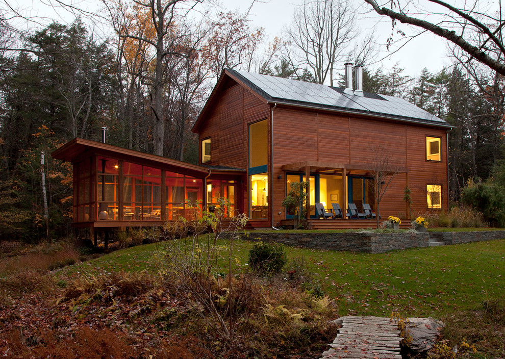 This is an example of a country exterior in New York with wood siding.