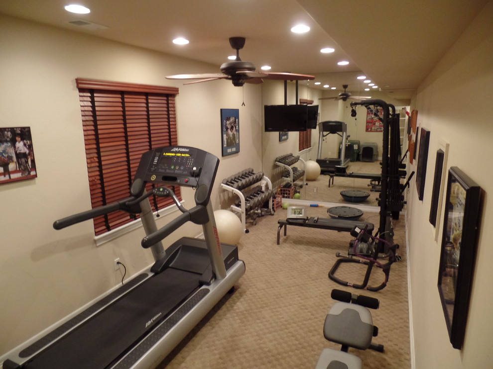 Design ideas for a small transitional home weight room in Denver with beige walls and carpet.