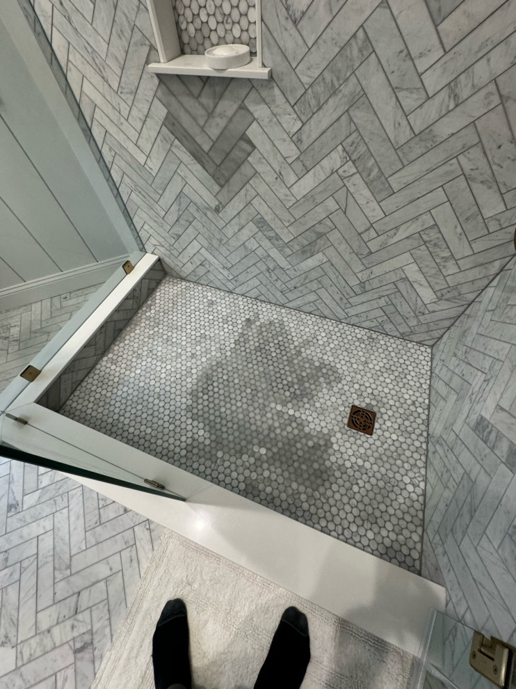 Carrara marble shower discoloration