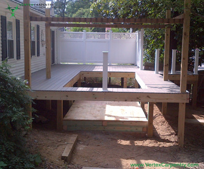 Small transitional side yard rectangular infinity pool fountain photo in DC Metro