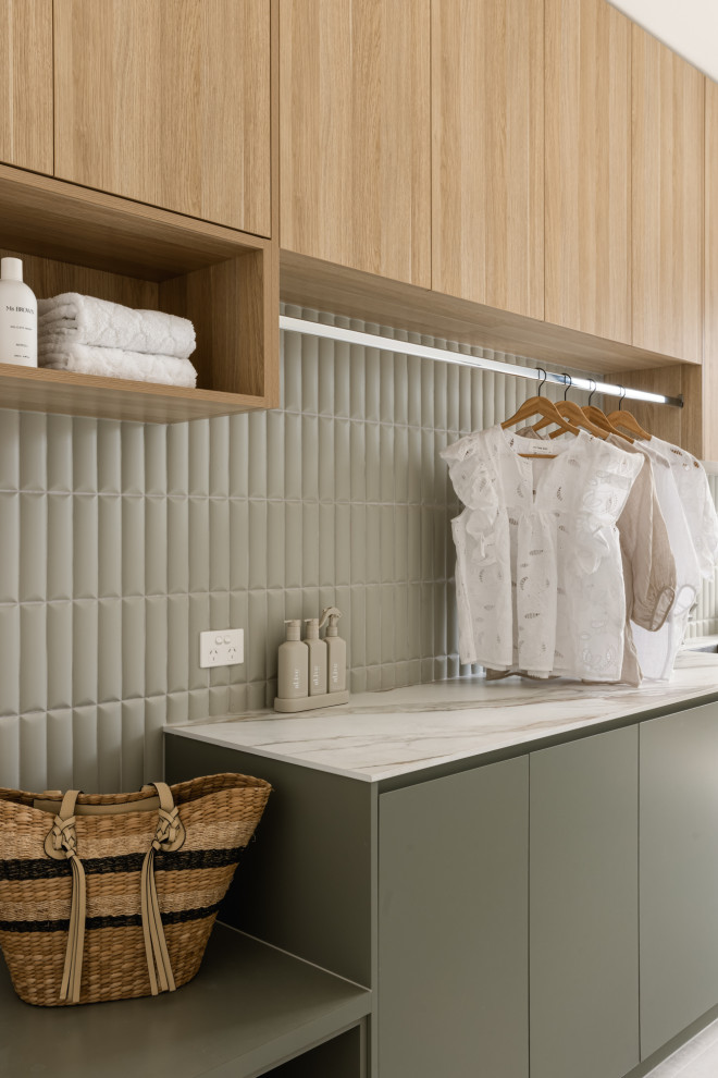 Inspiration for a mid-sized contemporary laundry room in Sunshine Coast.