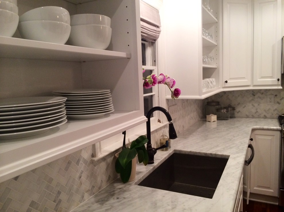 Inspiration for a huge transitional u-shaped dark wood floor eat-in kitchen remodel in Charlotte with an undermount sink, raised-panel cabinets, white cabinets, granite countertops, gray backsplash, porcelain backsplash, stainless steel appliances and an island