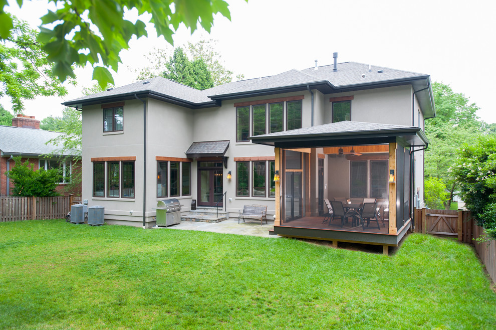 Small trendy screened-in back porch idea in DC Metro with decking