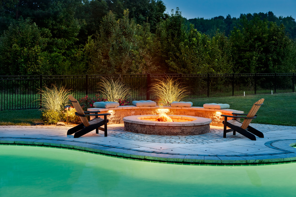 Design ideas for a large contemporary backyard garden in New York with a fire feature and natural stone pavers.