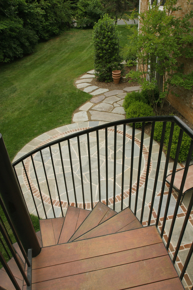 Mid-sized trendy backyard stone patio photo in DC Metro with no cover