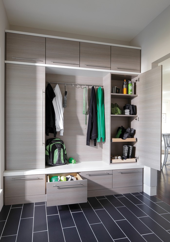 Mid-sized contemporary mudroom in Philadelphia with white walls, porcelain floors and black floor.