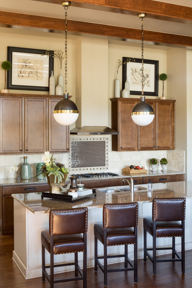 Transitional medium tone wood floor kitchen photo in Denver with brown backsplash, mosaic tile backsplash and beige countertops