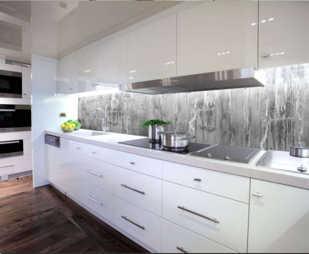 This is an example of a small contemporary single-wall eat-in kitchen in London with raised-panel cabinets, white cabinets, granite benchtops, grey splashback, porcelain splashback, stainless steel appliances and dark hardwood floors.