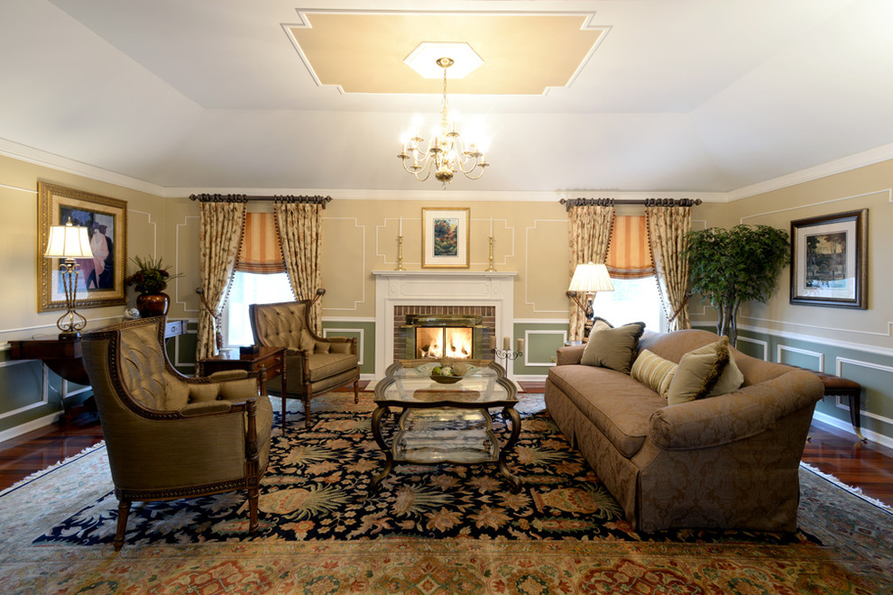 This is an example of a large traditional formal enclosed living room in Chicago with multi-coloured walls, dark hardwood floors, a standard fireplace, a wood fireplace surround and no tv.
