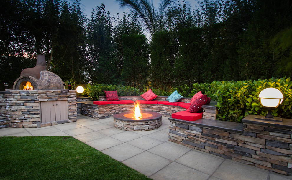 Mountain style backyard concrete paver full sun patio photo