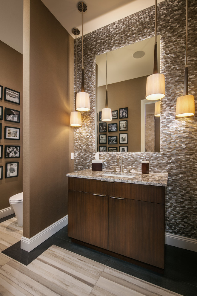 Mid-sized transitional 3/4 porcelain tile and beige tile porcelain tile and beige floor alcove shower photo in Omaha with brown walls, an undermount sink, a hinged shower door, flat-panel cabinets, dark wood cabinets and granite countertops