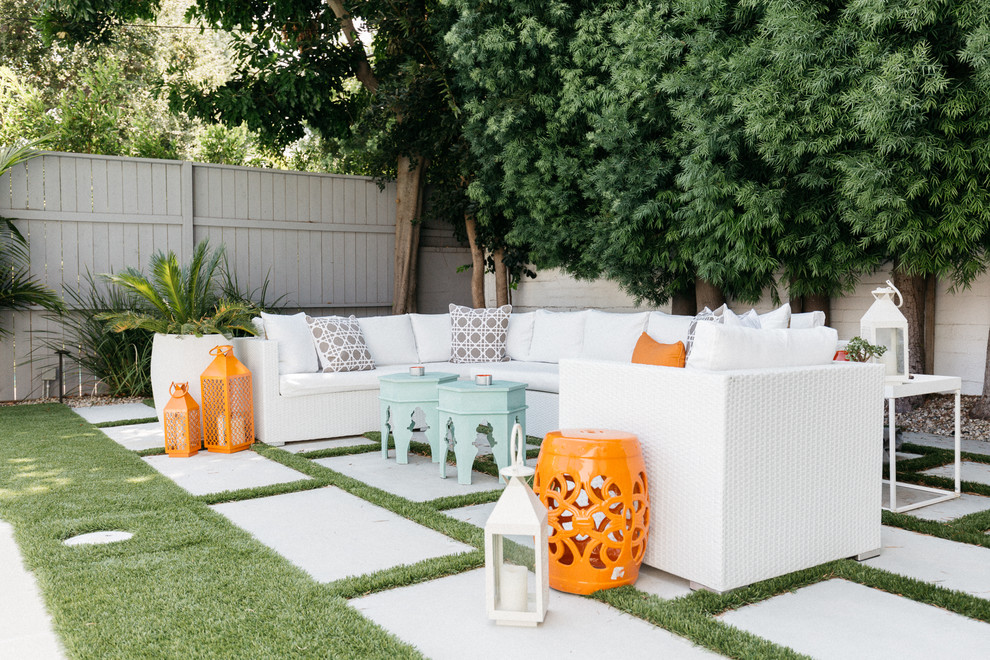 Eclectic backyard patio in Los Angeles with concrete pavers and no cover.
