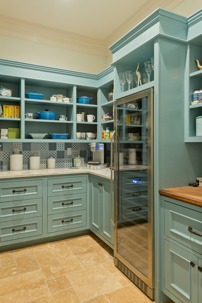 Large traditional l-shaped kitchen pantry in New York with open cabinets, multi-coloured splashback, stainless steel appliances, travertine floors, beige floor and turquoise cabinets.