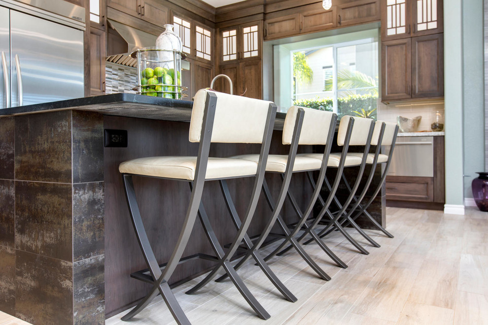 Example of a transitional kitchen design in Denver