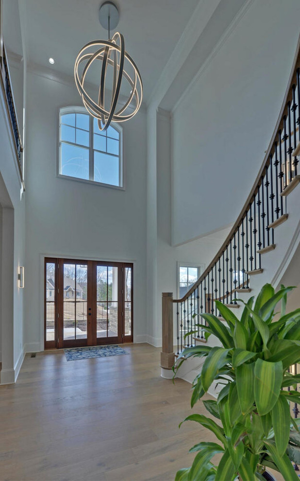 Entryway - transitional medium tone wood floor entryway idea in Atlanta