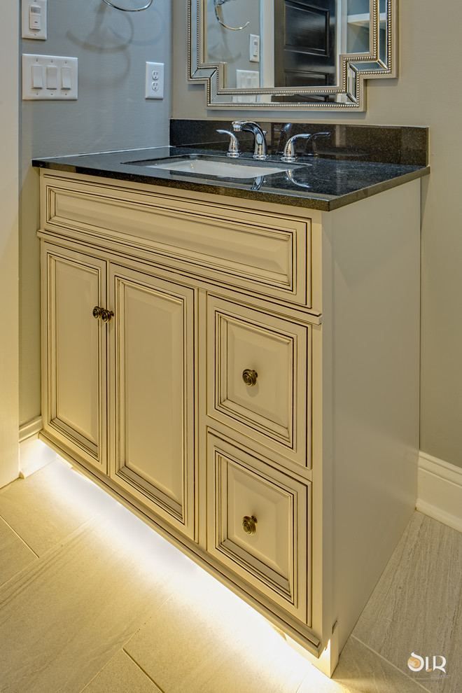 Alcove bathtub - transitional 3/4 dark wood floor and beige floor alcove bathtub idea with flat-panel cabinets, light wood cabinets and gray walls