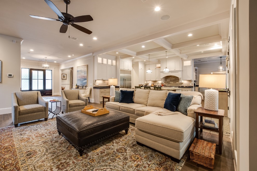 Inspiration for a large transitional open concept family room with white walls, a standard fireplace, a stone fireplace surround, a built-in media wall, brown floor and porcelain floors.