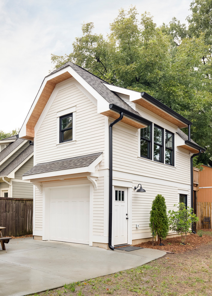 This is an example of a small arts and crafts two-storey white house exterior in Charlotte with concrete fiberboard siding, a gable roof and a shingle roof.
