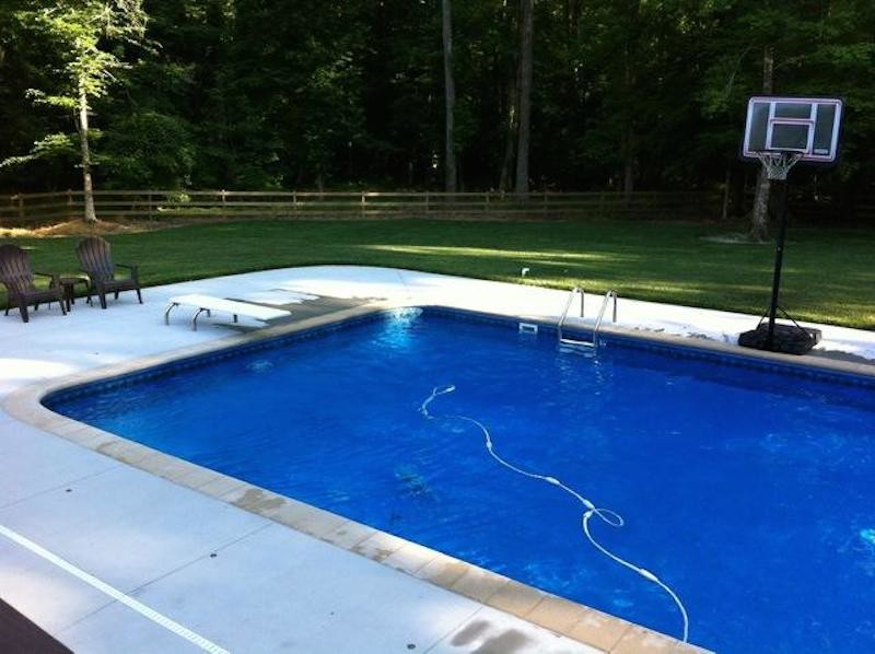 Backyard custom-shaped pool photo