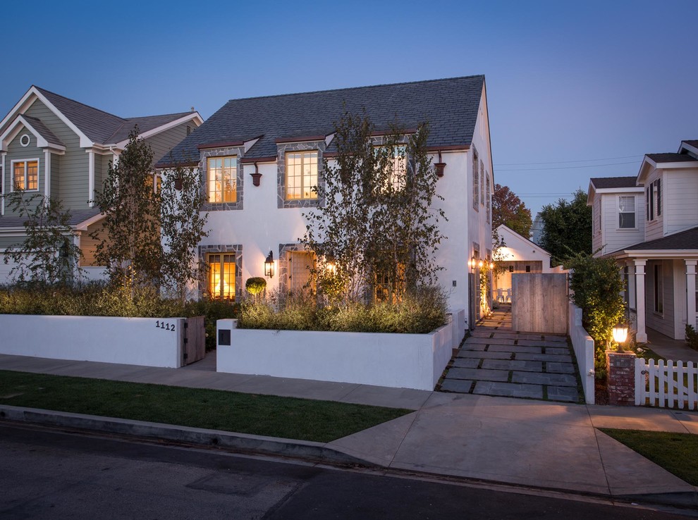 Transitional two-storey white exterior in Los Angeles.