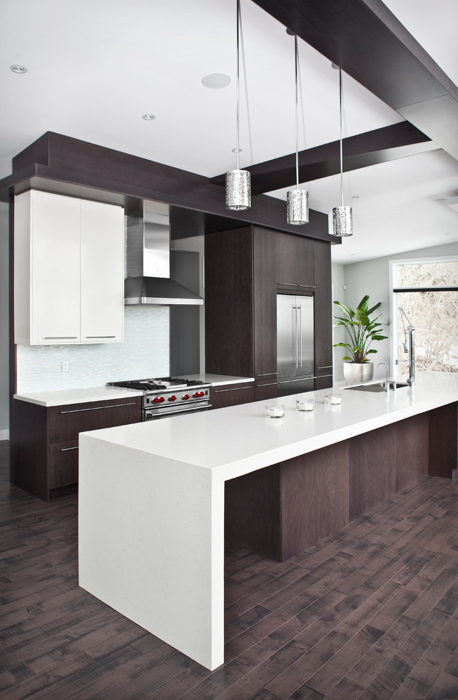 Inspiration for a contemporary kitchen in Burlington with flat-panel cabinets, stainless steel appliances and with island.