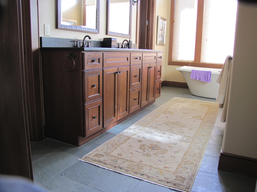 Mid-sized transitional master freestanding bathtub photo with recessed-panel cabinets