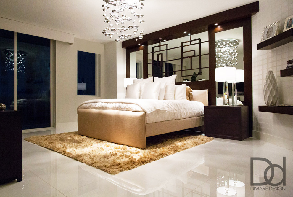 Inspiration for a large modern master bedroom in Miami with white walls and marble floors.