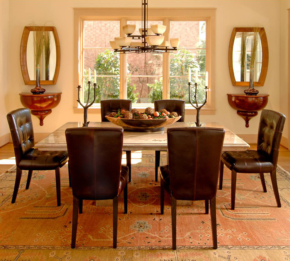 Photo of a transitional dining room in Dallas with white walls.