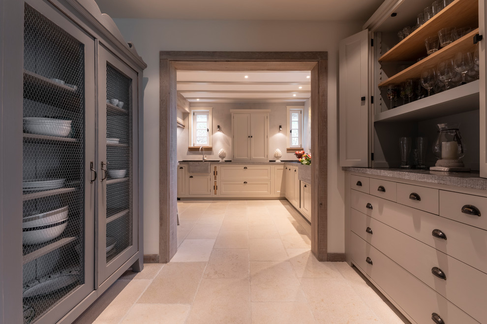 Design ideas for a large country single-wall open plan kitchen in Frankfurt with a double-bowl sink, beaded inset cabinets, grey cabinets, granite benchtops, grey splashback, panelled appliances, limestone floors, beige floor and grey benchtop.
