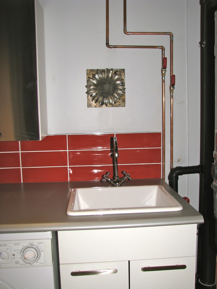 Exposed Pipes with Porcelain Sink Industrial Laundry Room Ottawa