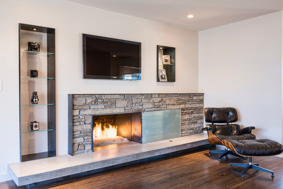 Mid-sized contemporary enclosed living room in Other with white walls, medium hardwood floors, a ribbon fireplace and a stone fireplace surround.